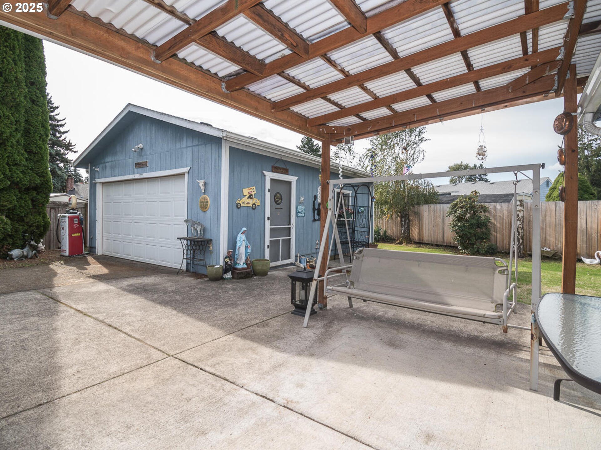 2068 Northeast Juniper Court Gresham, OR 97030 - Photo 42 of 42 a view of a porch with a bench
