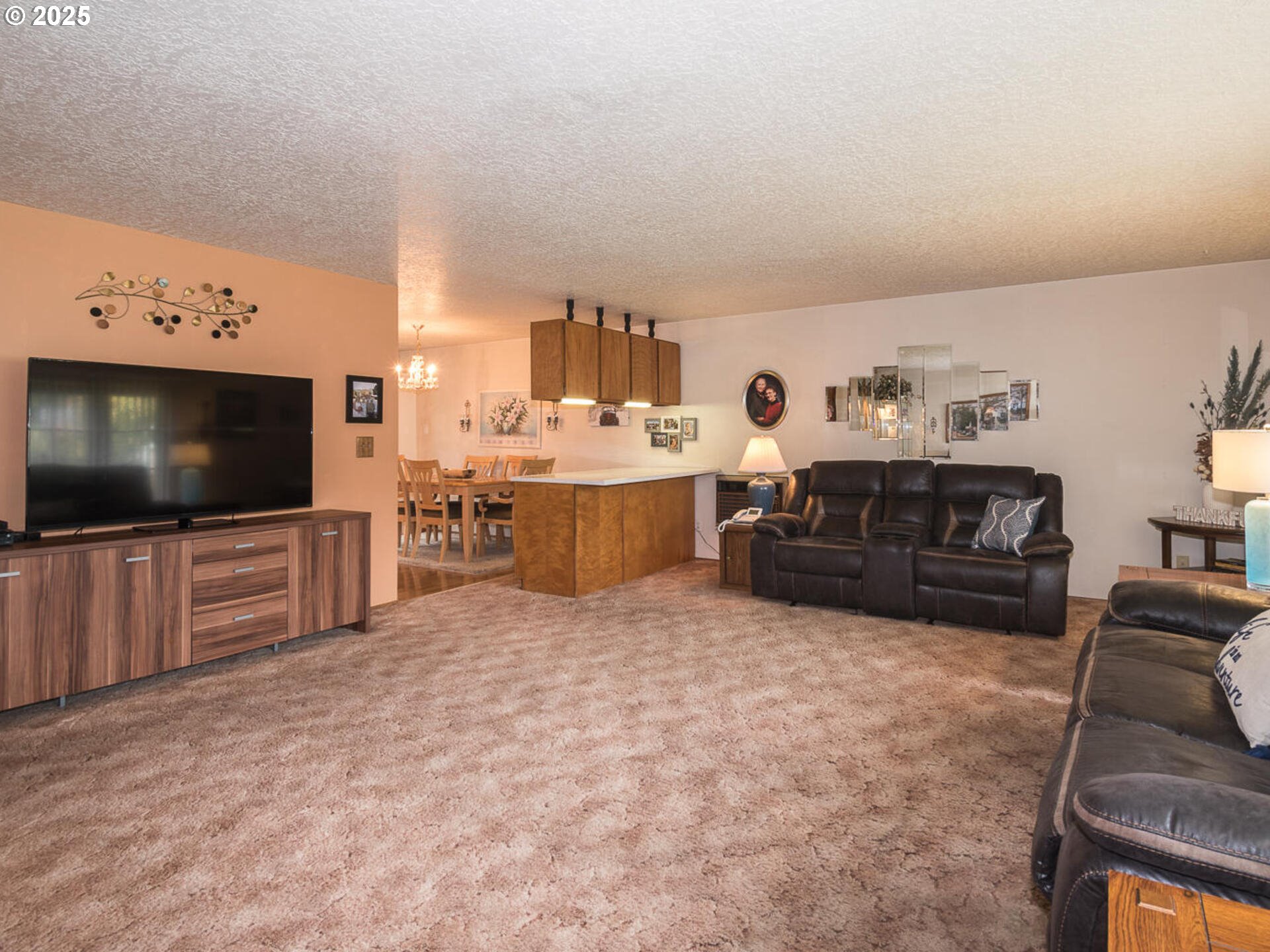 2068 Northeast Juniper Court Gresham, OR 97030 - Photo 7 of 42 a living room with furniture and a flat screen tv