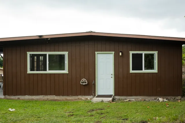 a backyard of a house with lots of green space