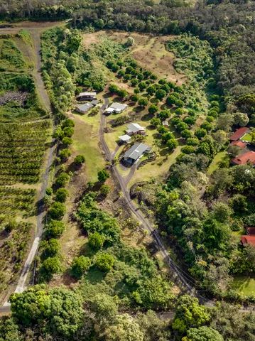 a view of a house with pool and a yard