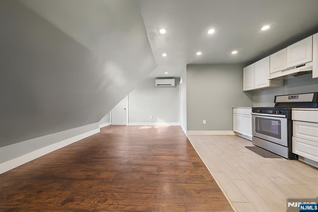 297 West Runyon Street Newark, NJ 07108 - Photo 12 of 14 a view of a kitchen with a sink and a stove