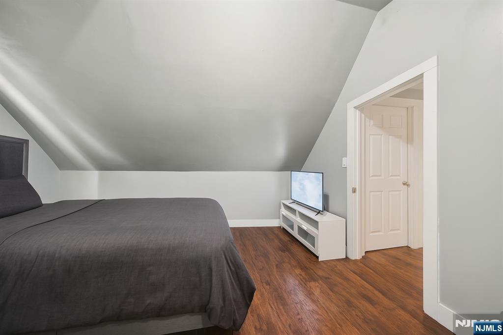 297 West Runyon Street Newark, NJ 07108 - Photo 14 of 14 a view of a bedroom with wooden floor and staircase