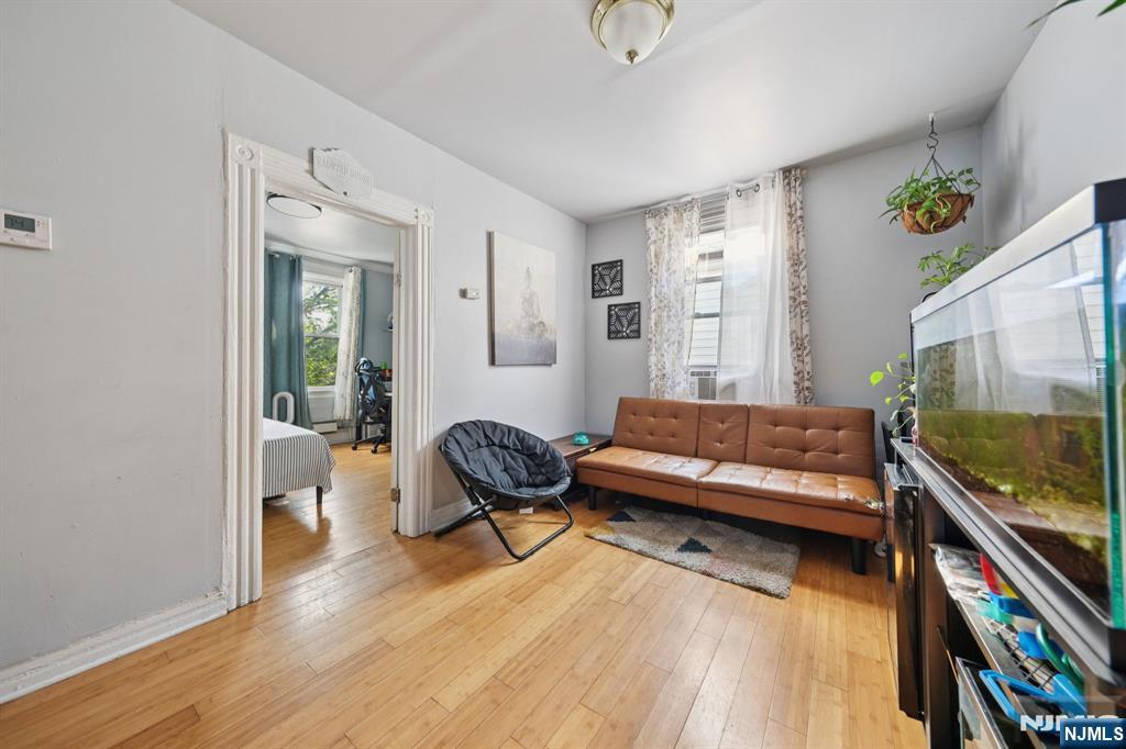 297 West Runyon Street Newark, NJ 07108 - Photo 5 of 14 a living room with furniture and a wooden floor