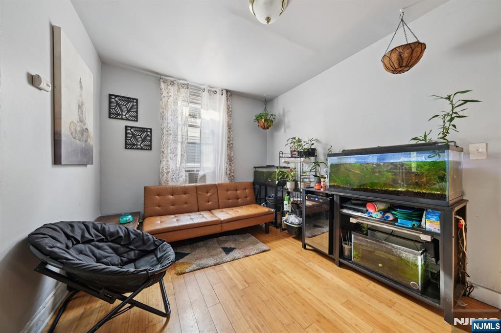 297 West Runyon Street Newark, NJ 07108 - Photo 7 of 14 a living room with furniture and a flat screen tv