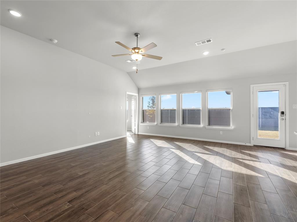 3301 Redbud Flower Trail Venus, TX 76084 - Photo 12 of 28 a view of an empty room with a window and wooden floor