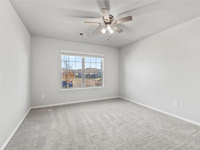 an empty room with a large window