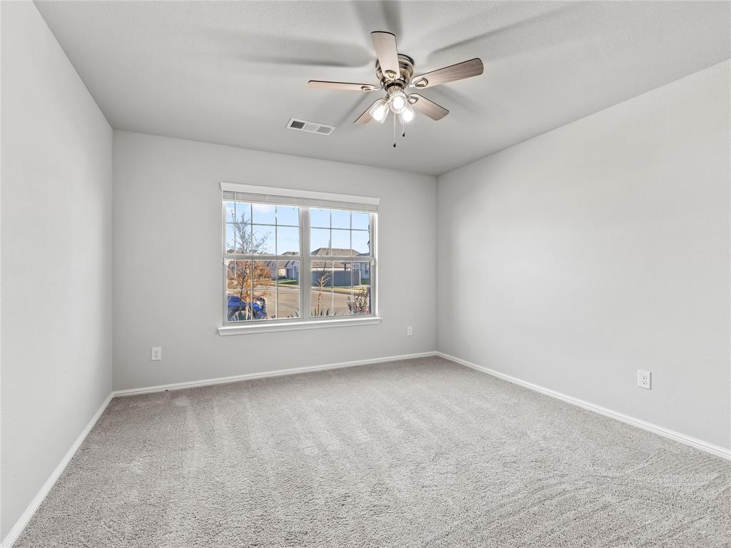 3301 Redbud Flower Trail Venus, TX 76084 - Photo 18 of 28 an empty room with a large window