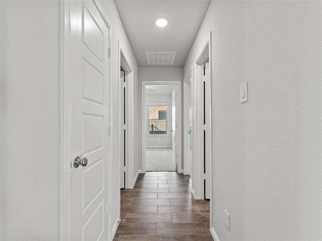 3301 Redbud Flower Trail Venus, TX 76084 - Photo 20 of 28 a view of a hallway with wooden floor