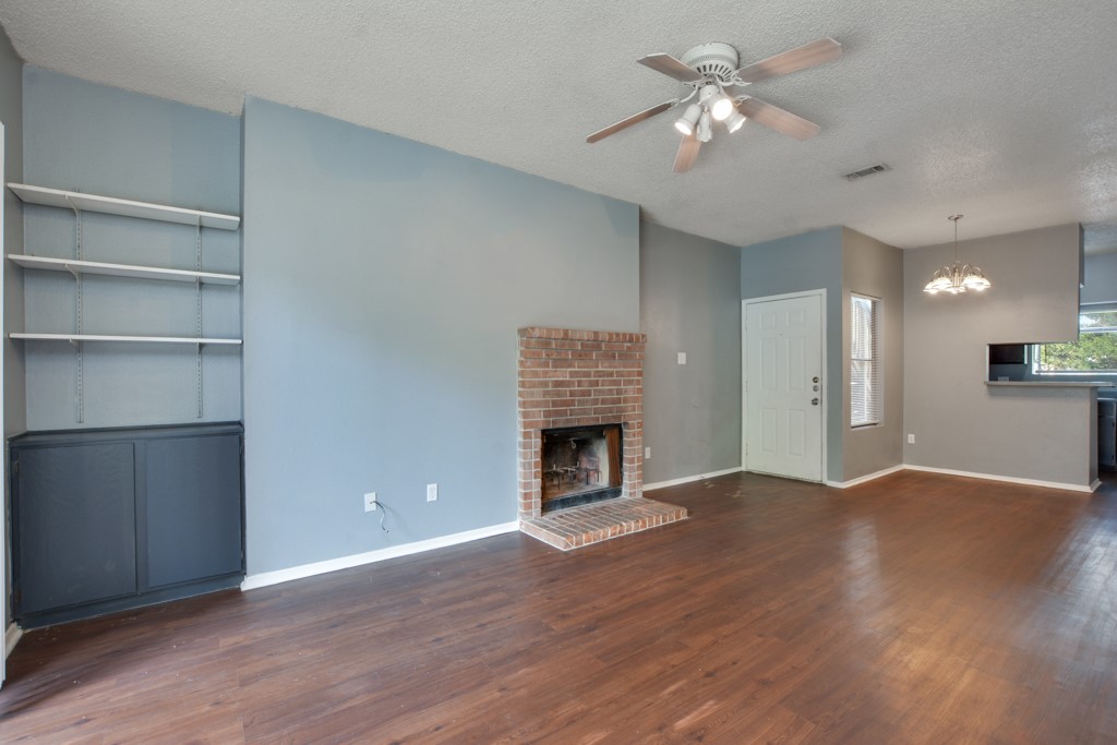 9506 Kempler Drive, Unit A Austin, TX 78748 - Photo 1 of 14 a view of an empty room with a fireplace and a window