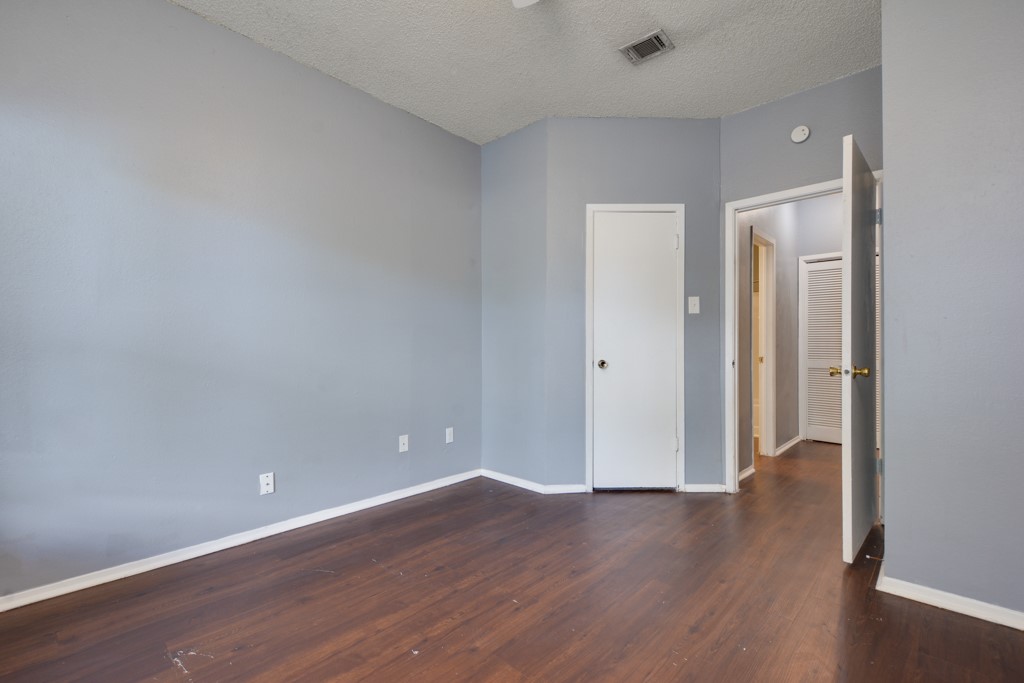 9506 Kempler Drive, Unit A Austin, TX 78748 - Photo 14 of 14 a view of an empty room with wooden floor