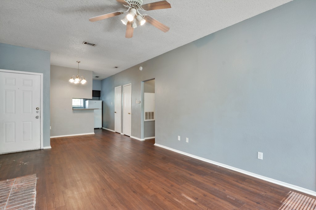 9506 Kempler Drive, Unit A Austin, TX 78748 - Photo 4 of 14 a view of an empty room and wooden floor