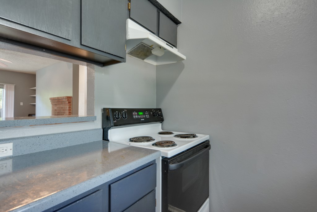 9506 Kempler Drive, Unit A Austin, TX 78748 - Photo 7 of 14 a kitchen with stainless steel appliances granite countertop a sink a stove and a microwave