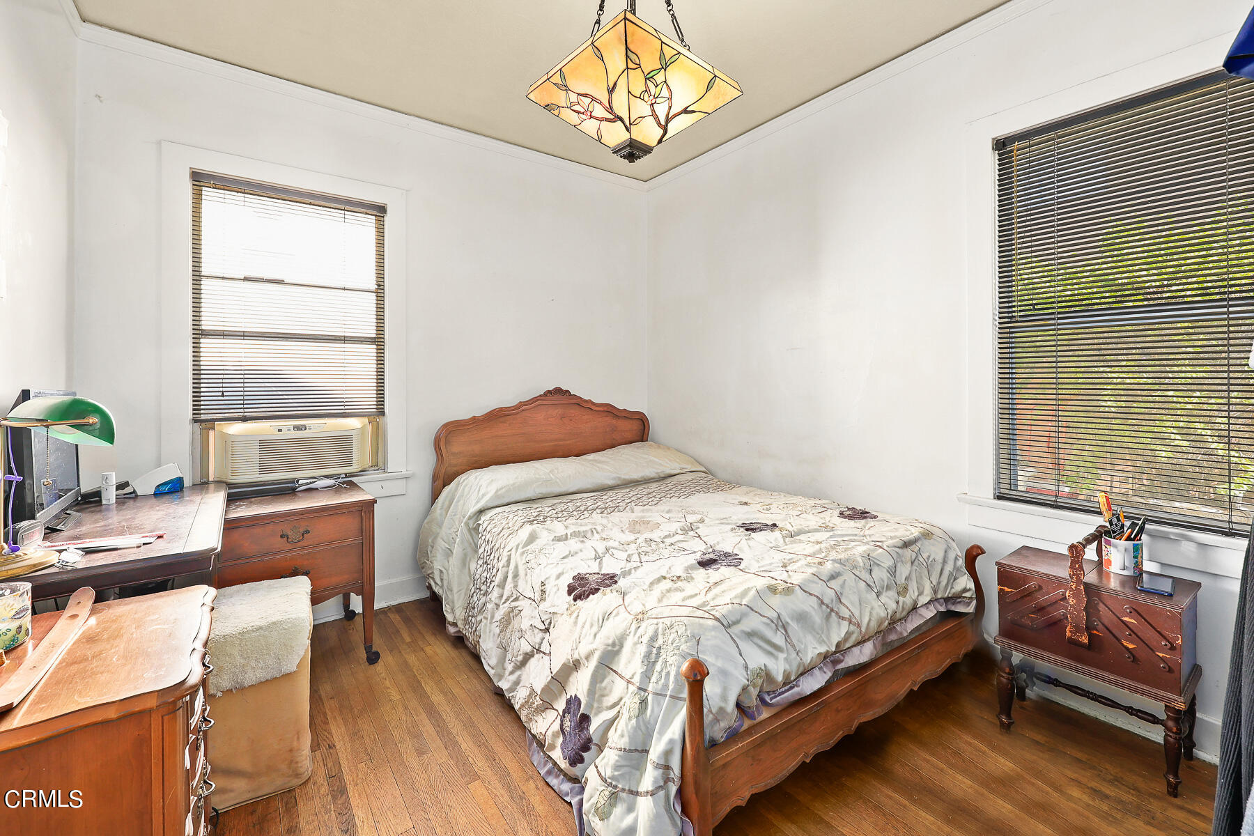 2536 Devonshire Lane Altadena, CA 91001 - Photo 19 of 32 a bedroom with a bed table and window