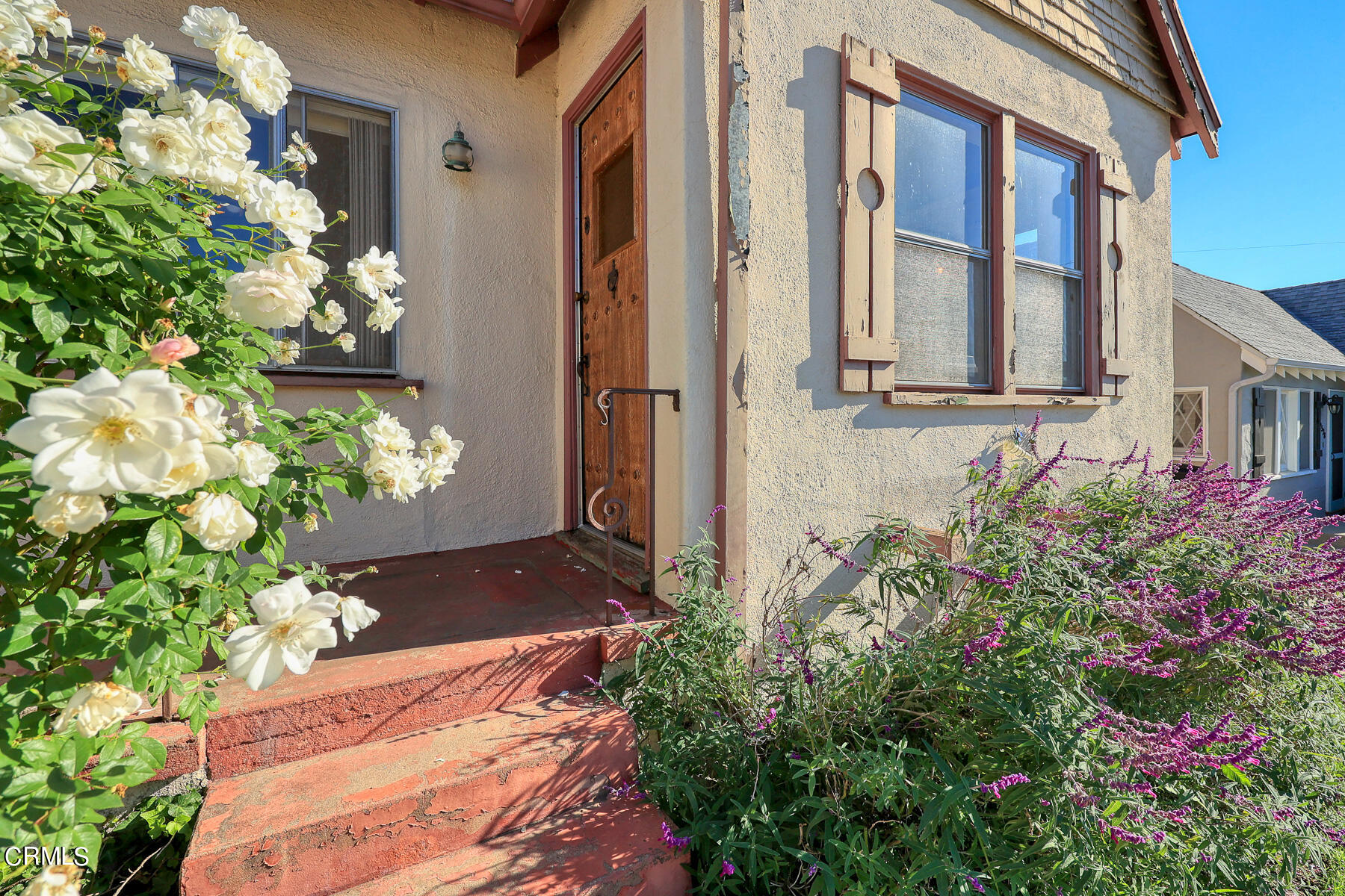 2536 Devonshire Lane Altadena, CA 91001 - Photo 3 of 32 a vase of flowers sitting in front of a door