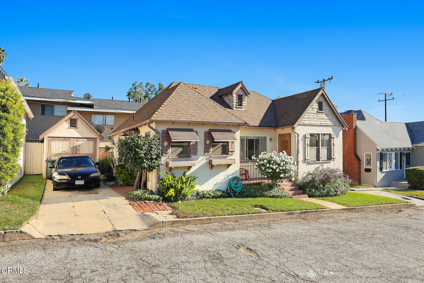 2536 Devonshire Lane Altadena, CA 91001 - Photo 31 of 32 a front view of a house with a yard and garage