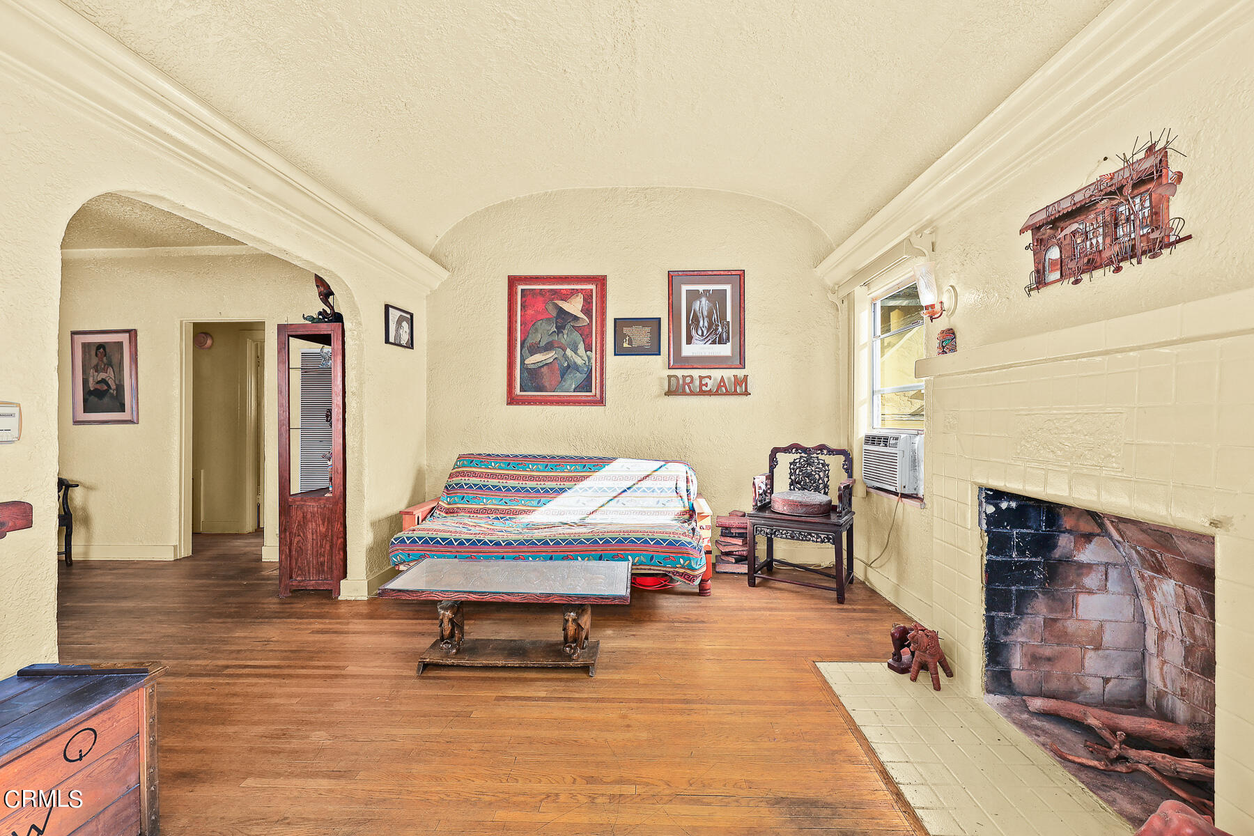 2536 Devonshire Lane Altadena, CA 91001 - Photo 8 of 32 a bedroom with furniture and a fireplace