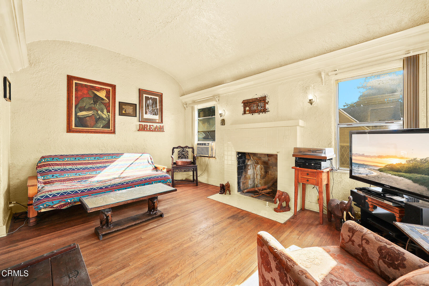 2536 Devonshire Lane Altadena, CA 91001 - Photo 9 of 32 a living room with furniture and a fireplace