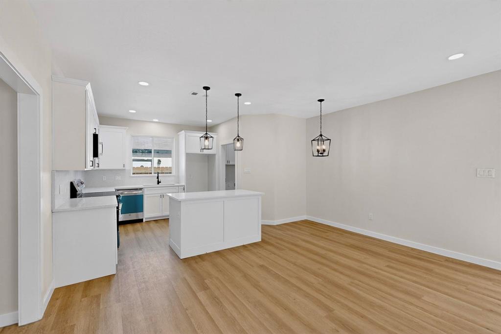 208 Rusk Street Rice, TX 75155 - Photo 11 of 27 a view of kitchen with furniture and wooden floor