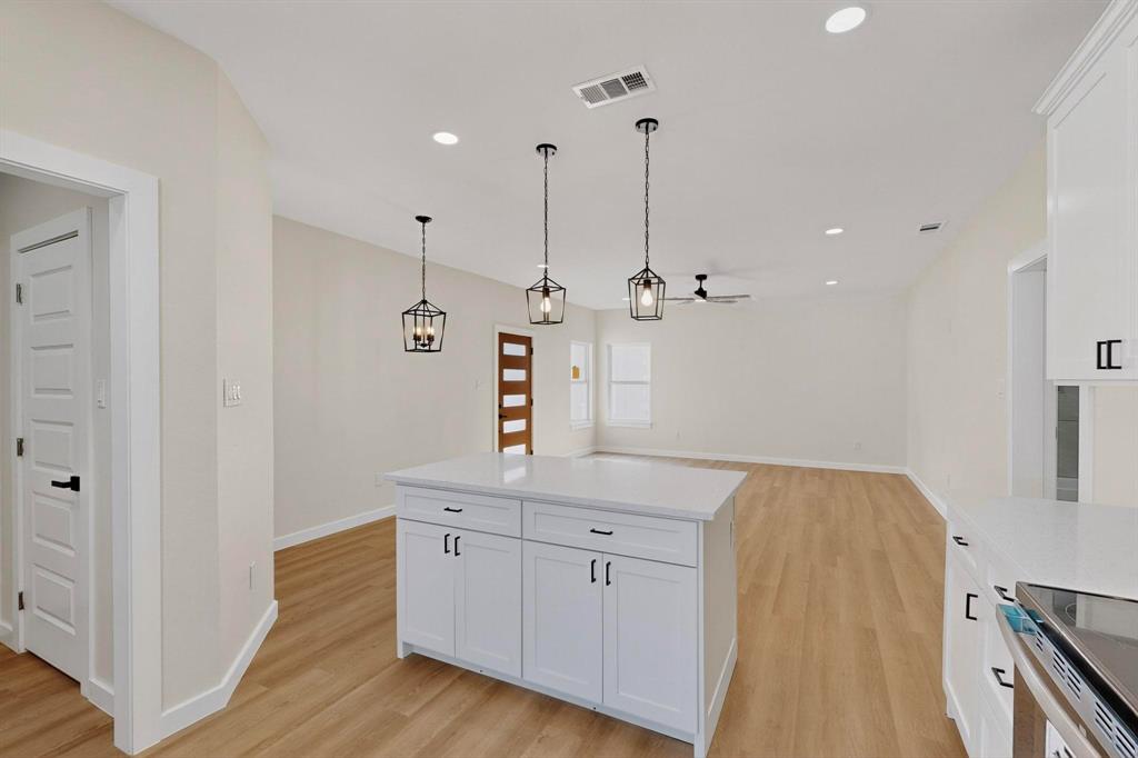 208 Rusk Street Rice, TX 75155 - Photo 14 of 27 a view of a kitchen with sink and wooden floor