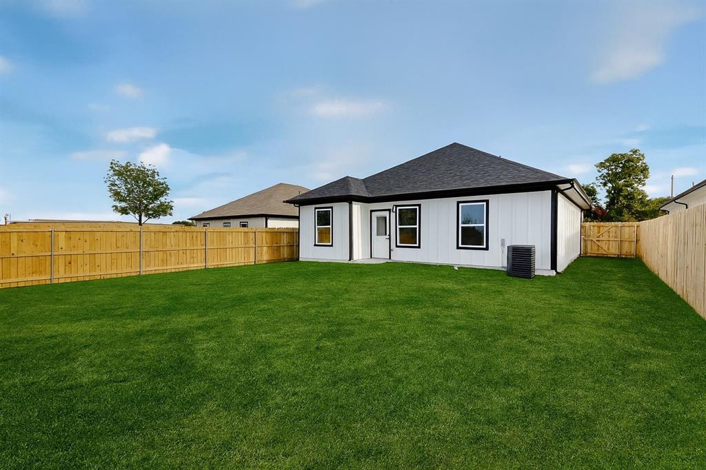 208 Rusk Street Rice, TX 75155 - Photo 27 of 27 a front view of a house with a yard