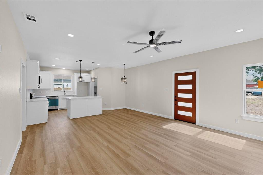 208 Rusk Street Rice, TX 75155 - Photo 10 of 27 a view of a kitchen with furniture and a ceiling fan