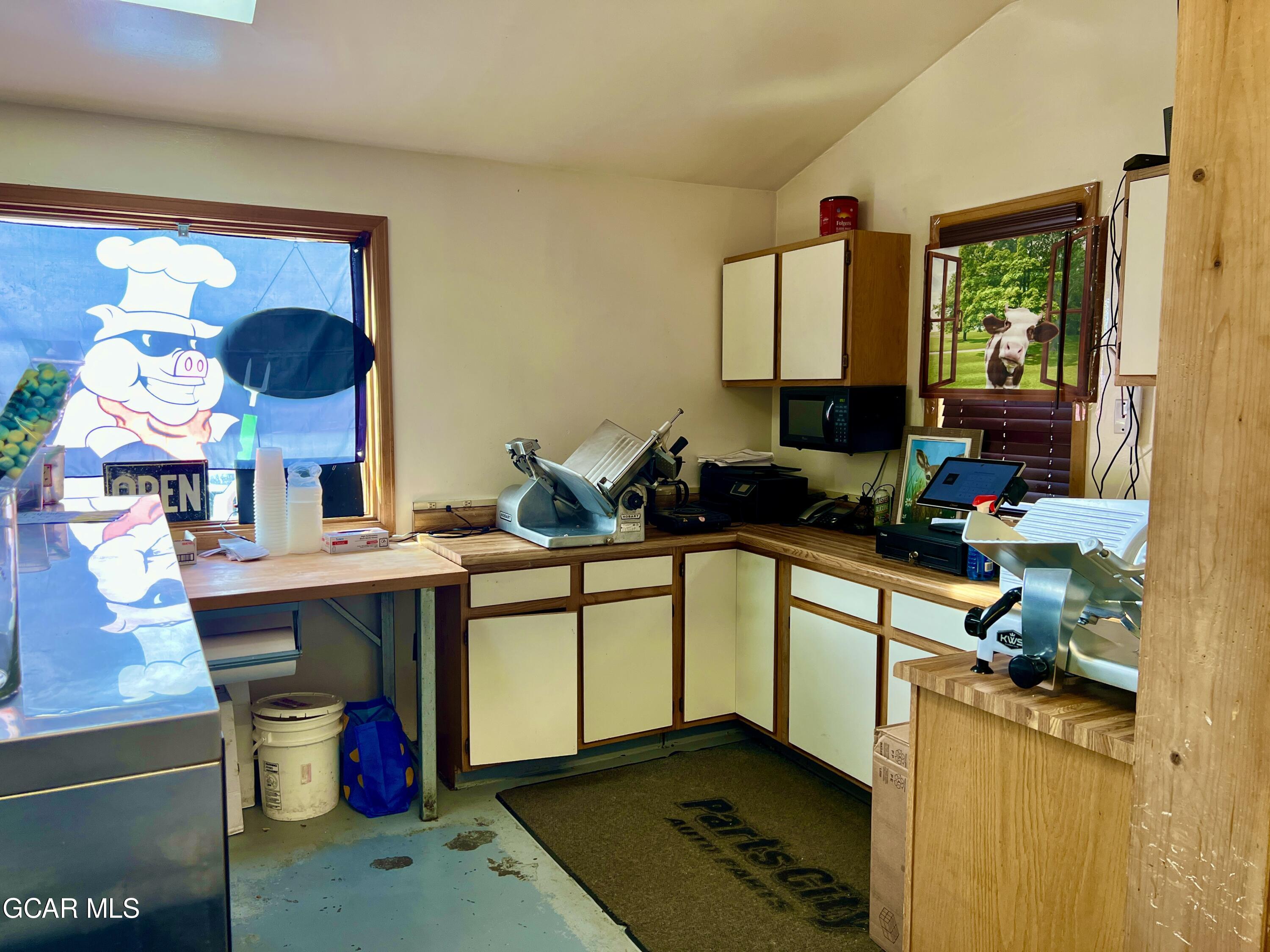 1107 Highway 9 Kremmling, CO 80459 - Photo 18 of 19 a kitchen with a sink appliances and cabinets
