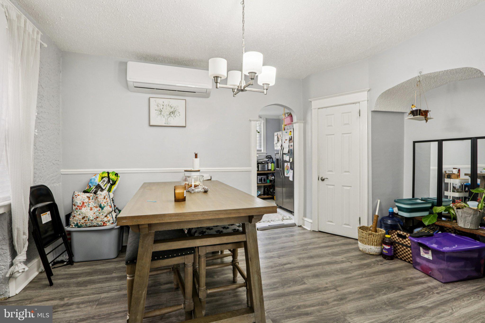 133 High Street Sharon Hill, PA 19079 - Photo 12 of 45 a dining room with furniture a chandelier and wooden floor