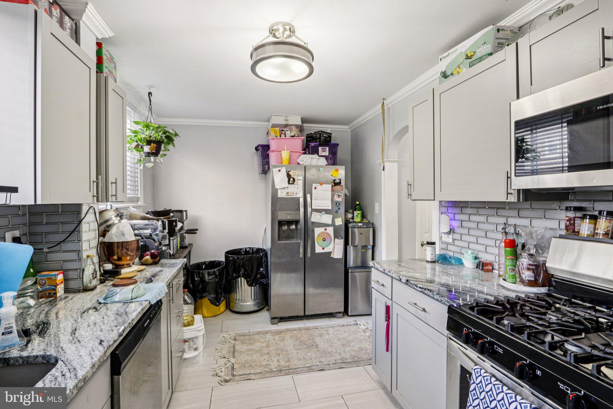 133 High Street Sharon Hill, PA 19079 - Photo 19 of 45 a kitchen with a refrigerator and a sink