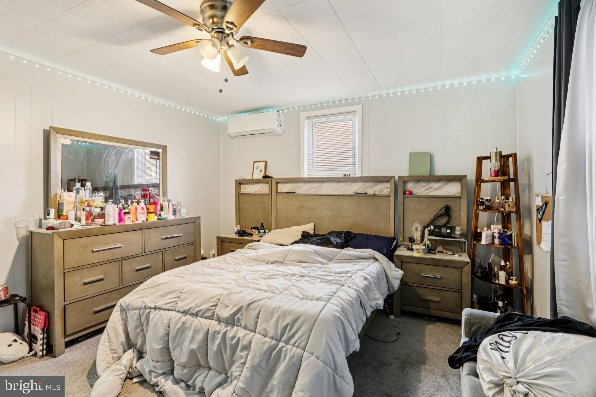 133 High Street Sharon Hill, PA 19079 - Photo 21 of 45 a bedroom with a bed and a chandelier