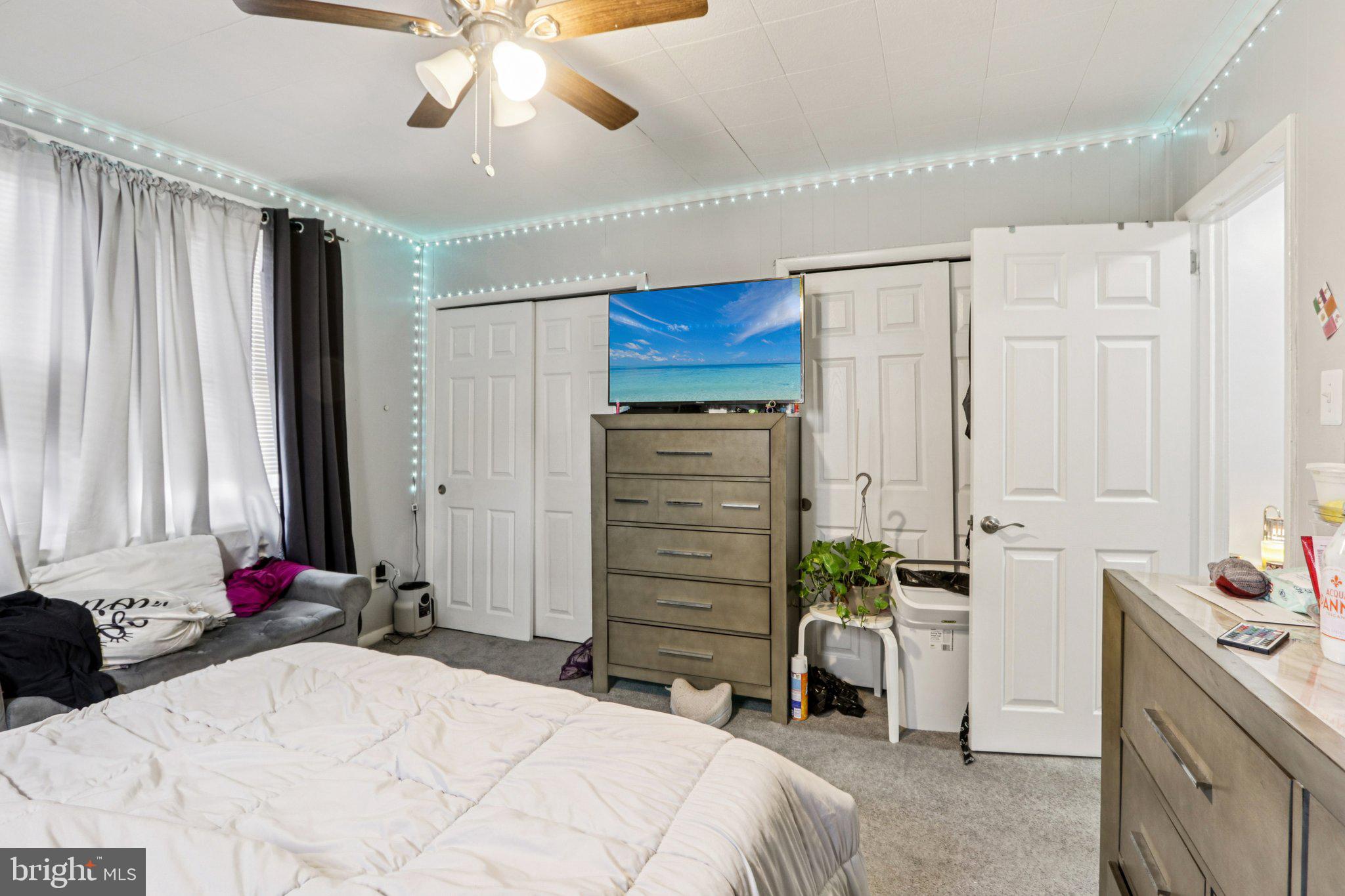 133 High Street Sharon Hill, PA 19079 - Photo 23 of 45 a bedroom with a bed and a chandelier