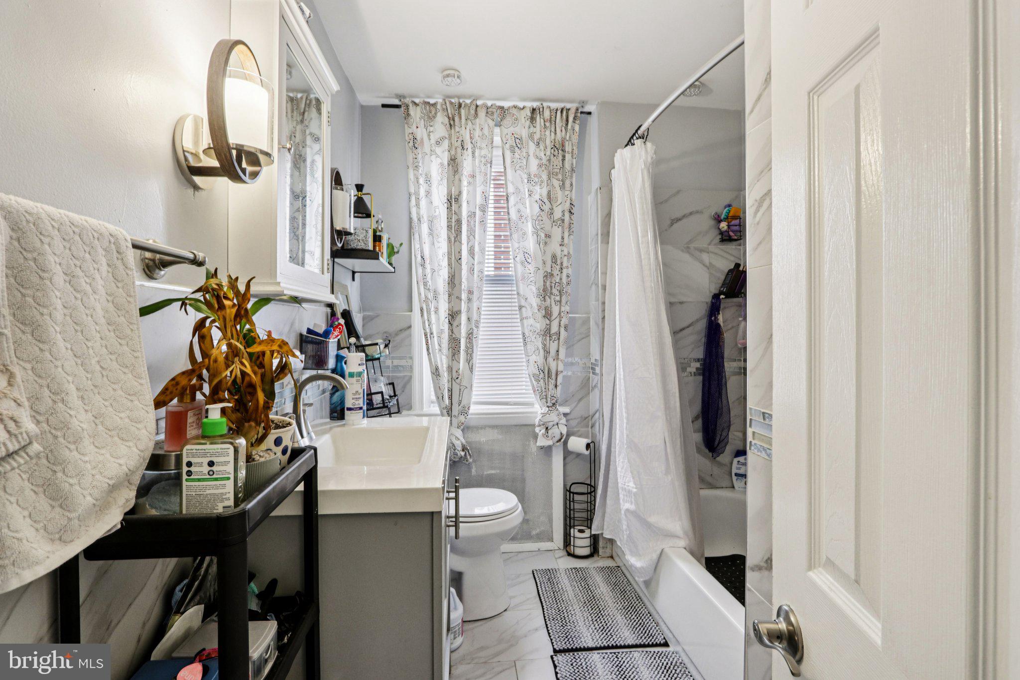 133 High Street Sharon Hill, PA 19079 - Photo 26 of 45 a view of a bathroom with a tub and sink