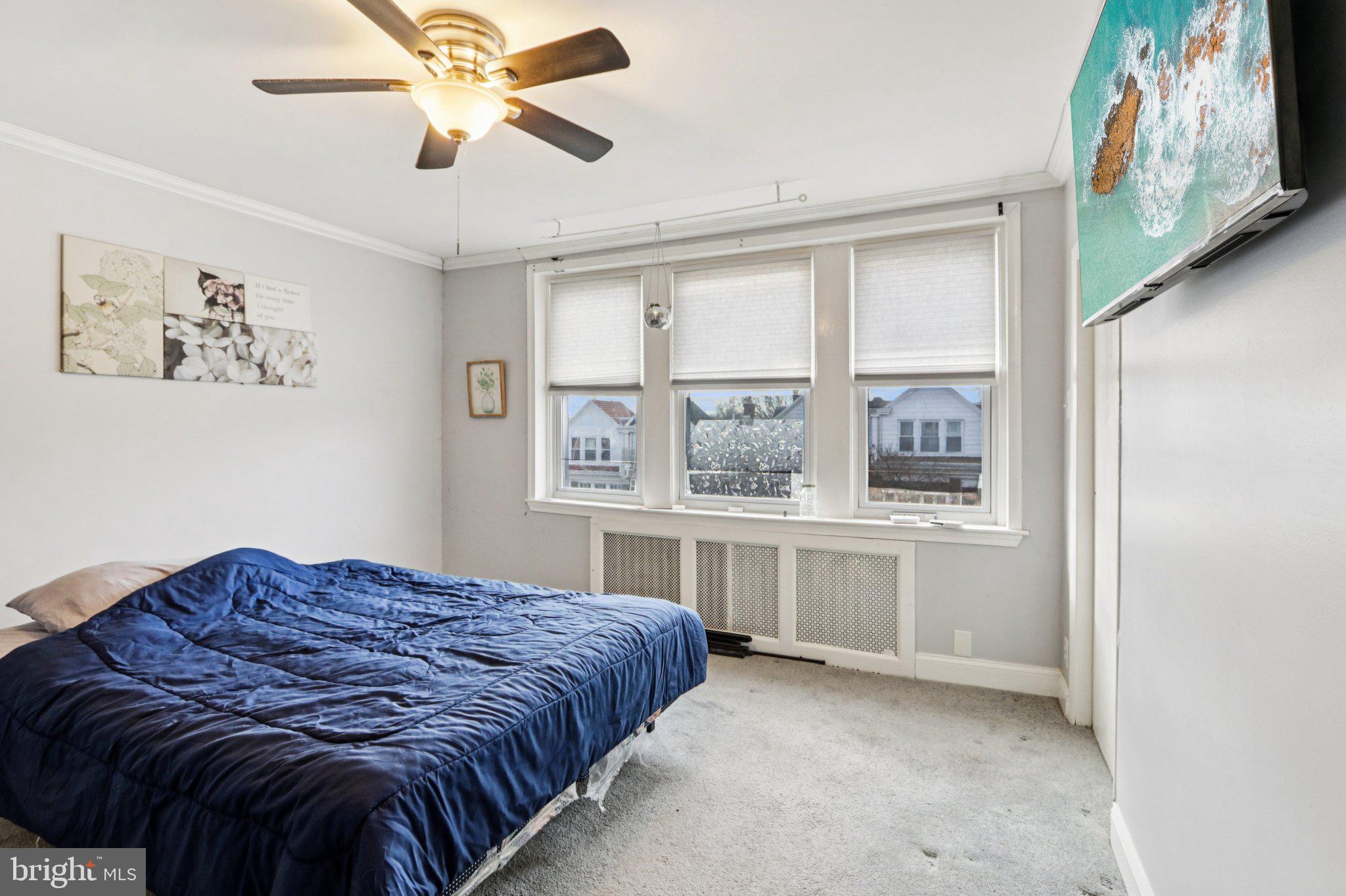 133 High Street Sharon Hill, PA 19079 - Photo 28 of 45 a bedroom with a large bed and a window