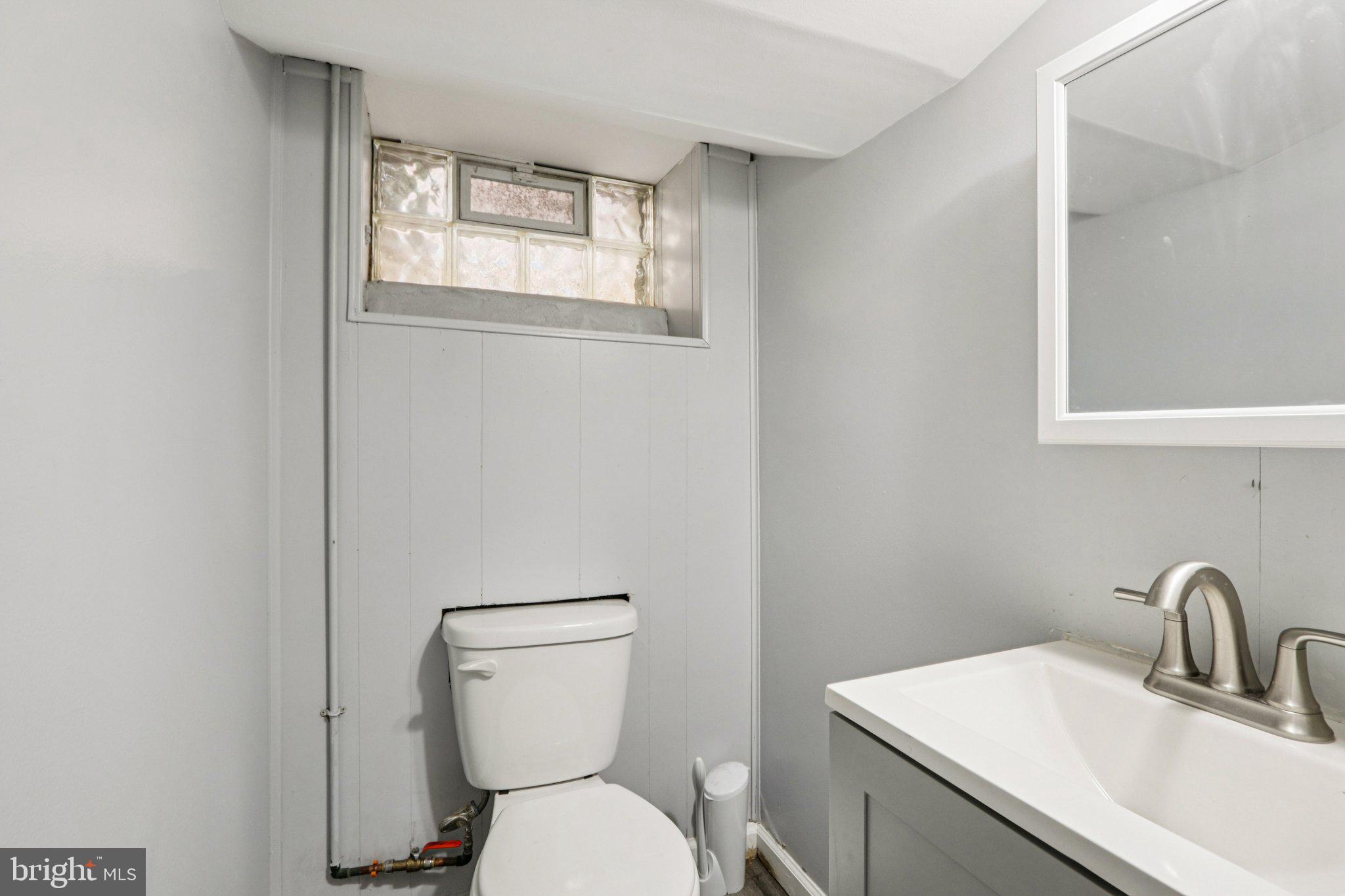 133 High Street Sharon Hill, PA 19079 - Photo 33 of 45 a bathroom with a toilet sink and mirror