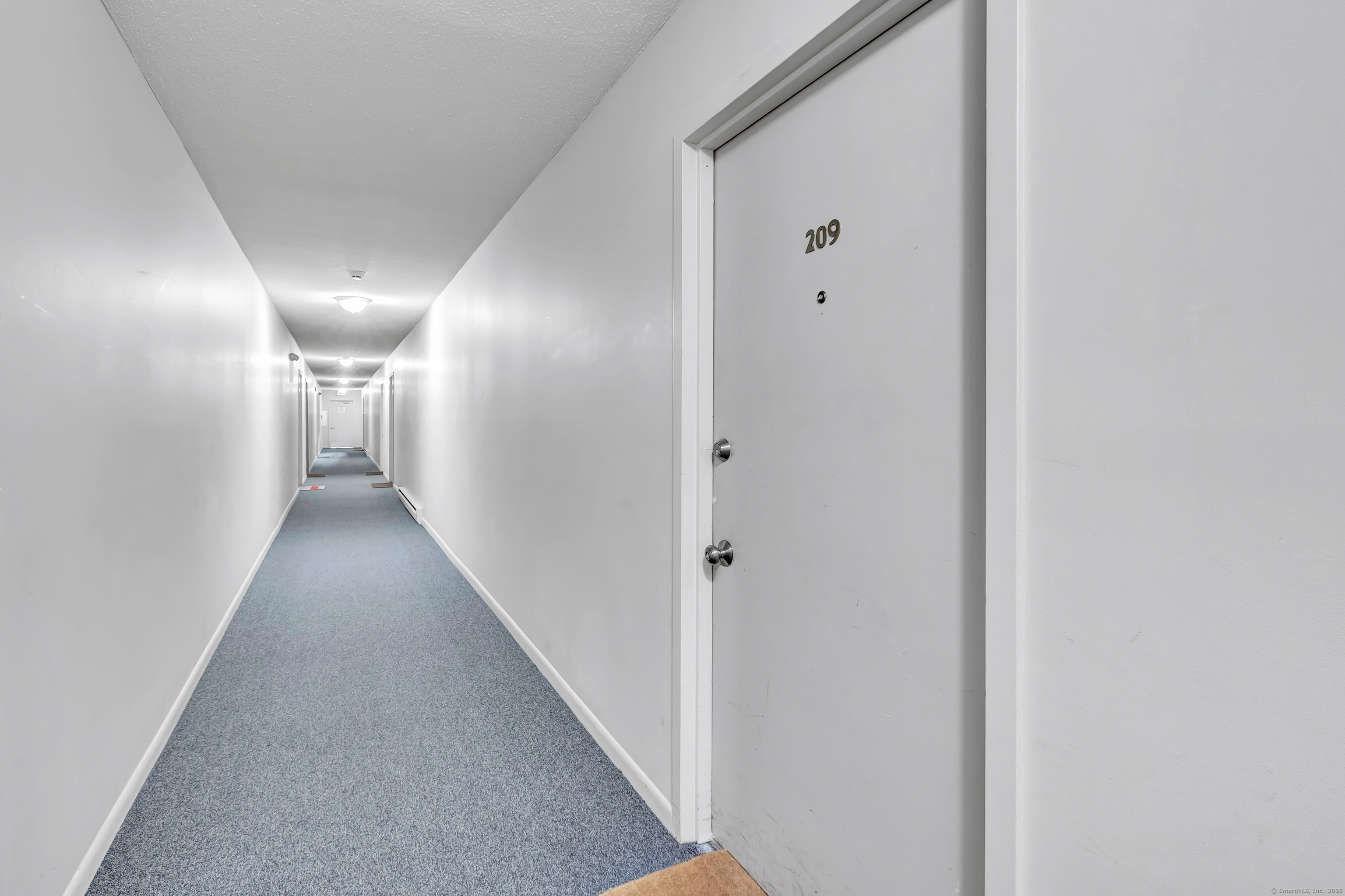 155 Short Beach Road, Unit 209 Stratford, CT 06615 - Photo 17 of 22 a view of hallway with closet