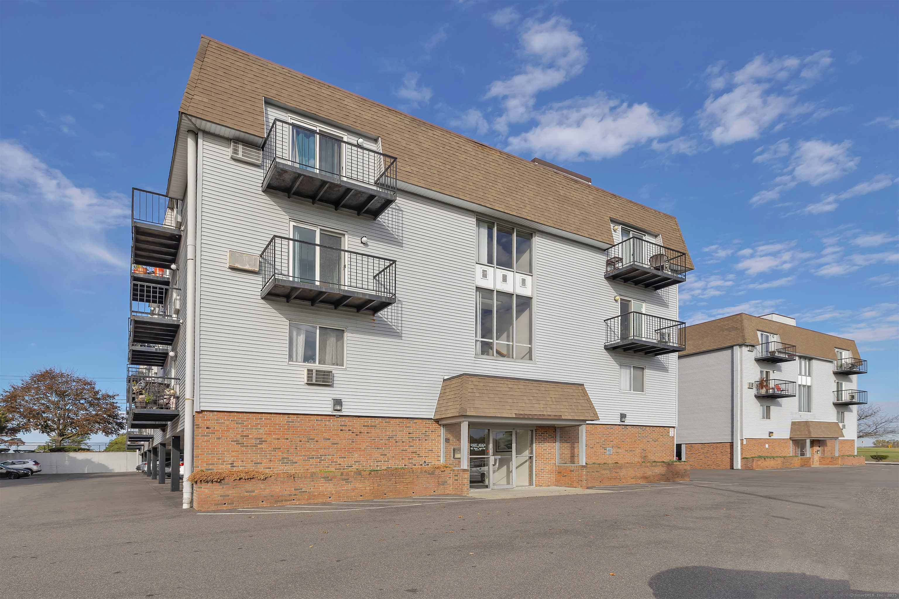 155 Short Beach Road, Unit 209 Stratford, CT 06615 - Photo 19 of 22 a front view of a building with street