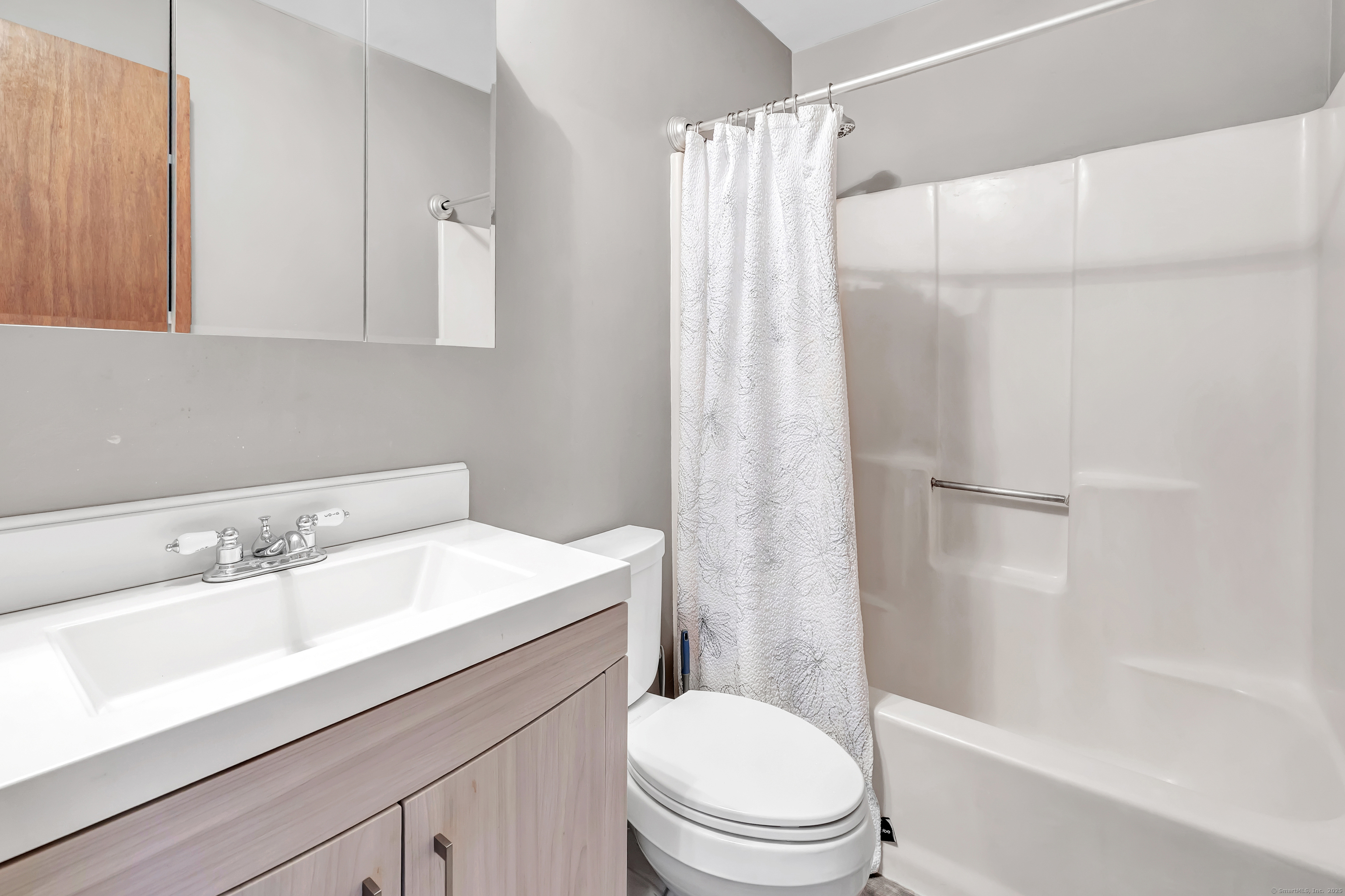 155 Short Beach Road, Unit 209 Stratford, CT 06615 - Photo 20 of 22 a bathroom with a sink a toilet and shower