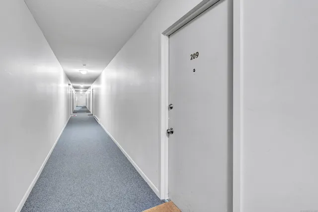 a view of hallway with closet