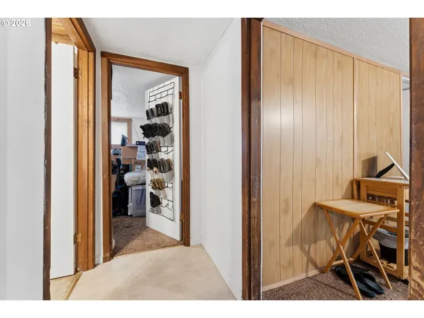 a view of a room and a livingroom with furniture