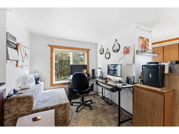 a workspace with furniture and a window