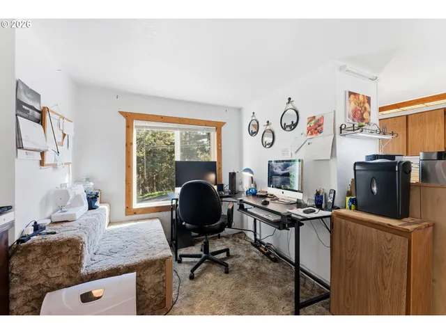 a workspace with furniture and a window