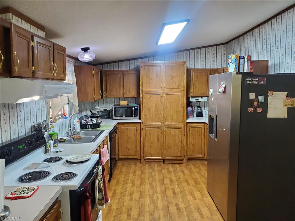 kitchen with "secret" pantry behind double doors with 10 x 5 storage pantry