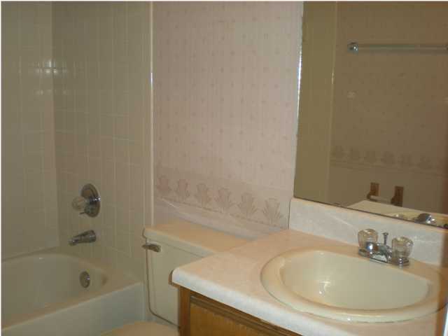 2835 Old Mill Way Crestview, FL 32539 - Photo 14 of 25 a bathroom with a sink and a bathtub