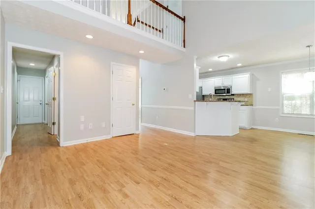 a view of a kitchen with a sink and a window