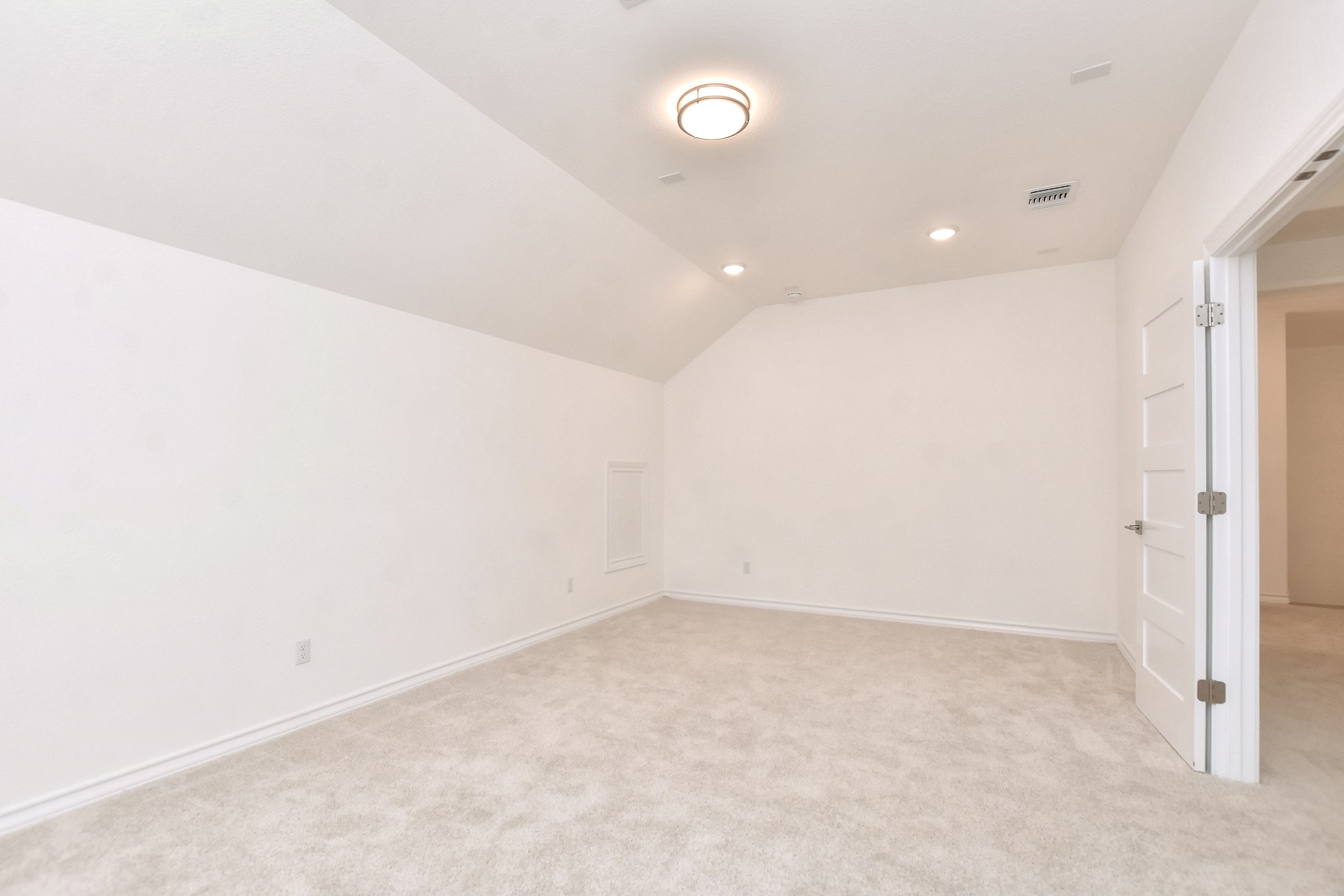 309 Wolf Rdg Road Georgetown, TX 78628 - Photo 25 of 39 Additional living space with light colored carpet, lofted ceiling, and recessed lighting