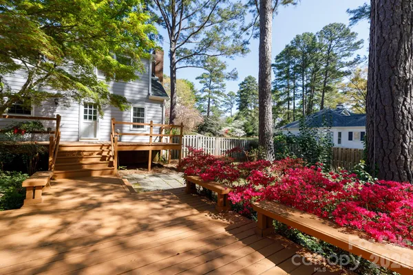 a view of outdoor space with garden and furniture