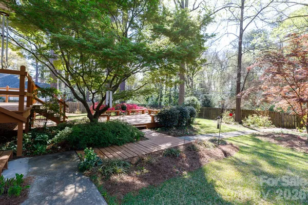 a backyard of a house with lots of green space