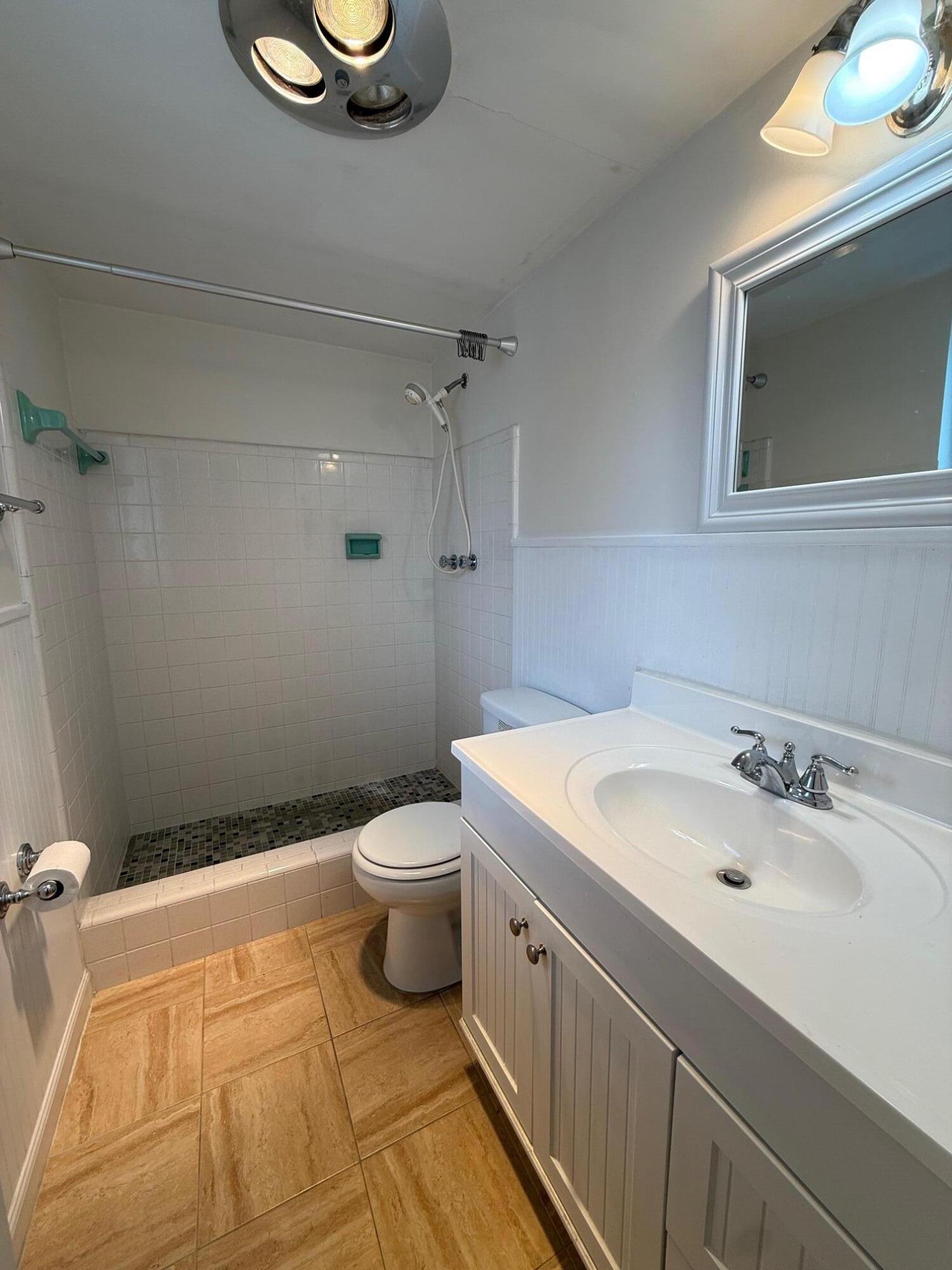 3850 Northeast 21st Way, Unit 53 Lighthouse Point, FL 33064 - Photo 15 of 18 a bathroom with a sink and a toilet