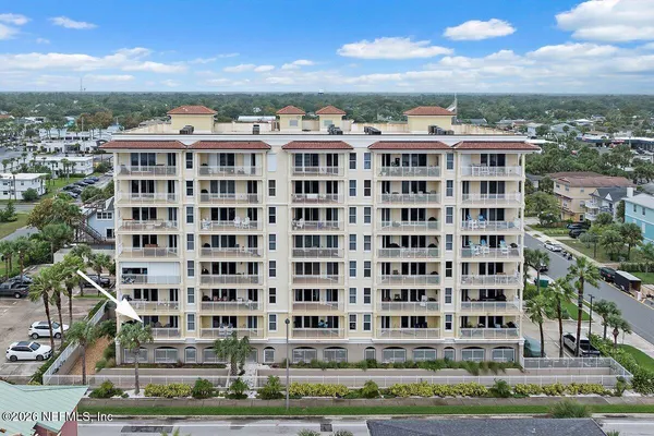 a view of a building with a yard