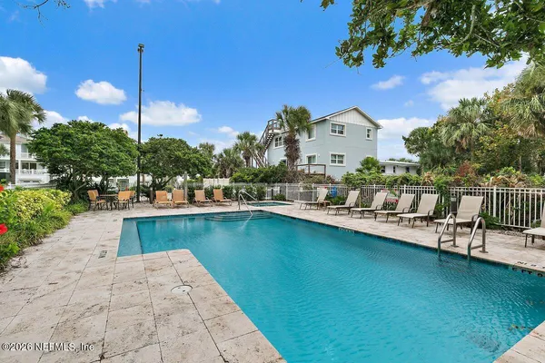 a view of swimming pool from a balcony
