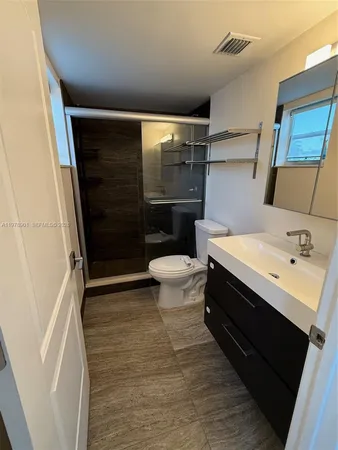 a bathroom with a sink and a toilet